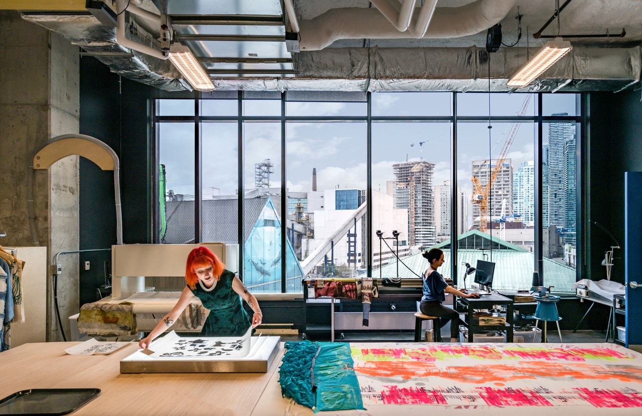 Interior of Launchpad with view of the city through the window