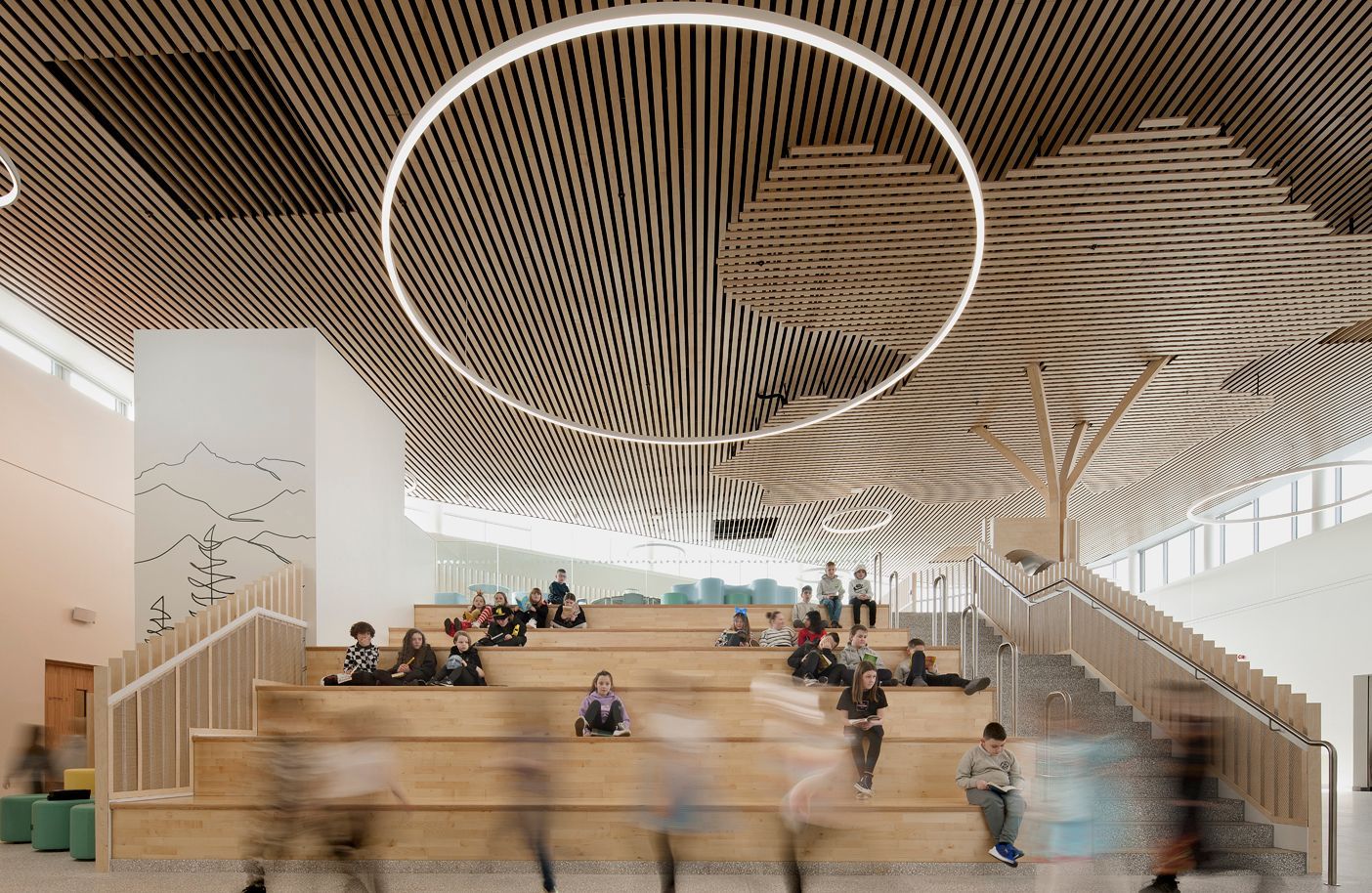 Newmains and St Bridig school interior atrium stairs with children