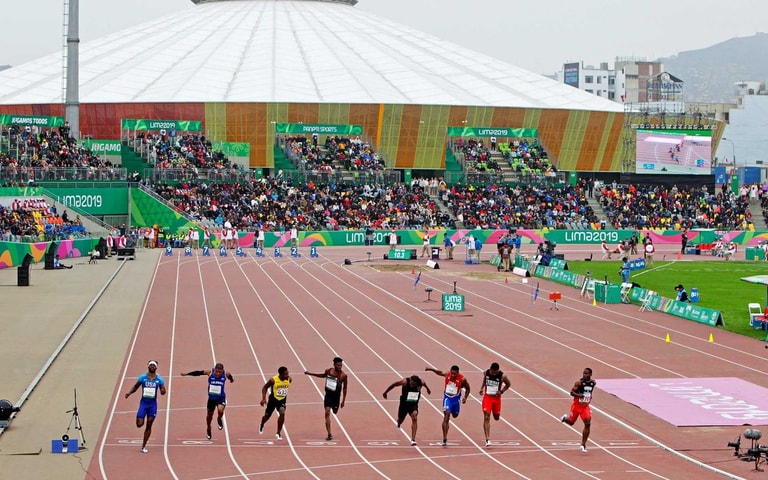 VIDENA Athletics Stadium with runners competing